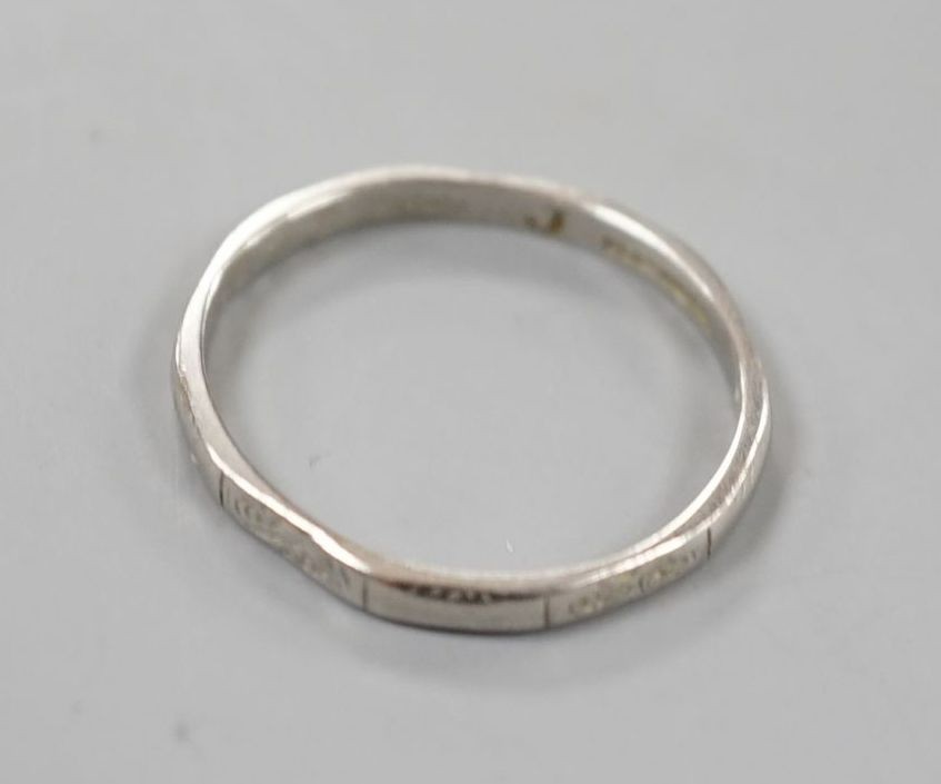 A white metal (stamped platinum) wedding band, size K